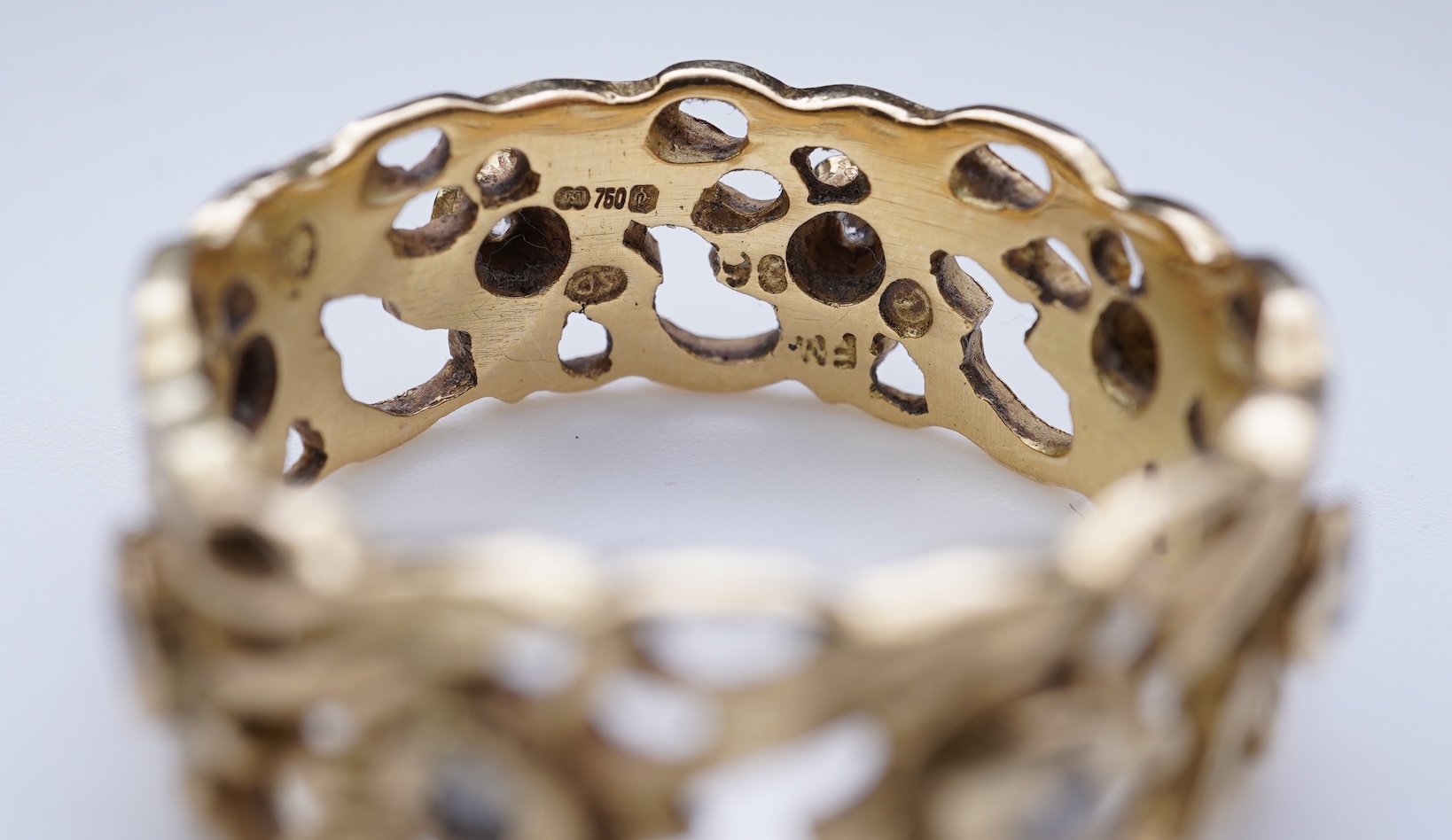 A gold and diamond eternity ring